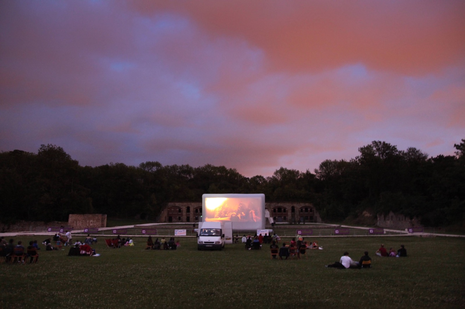 Open-air cinema screening on an inflatable screen: ‘Hallucine’ at sunset